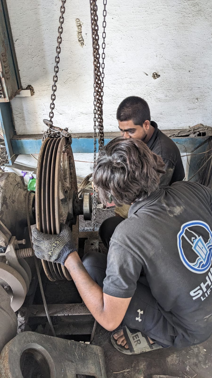Shinkai team working together on elevator machinery